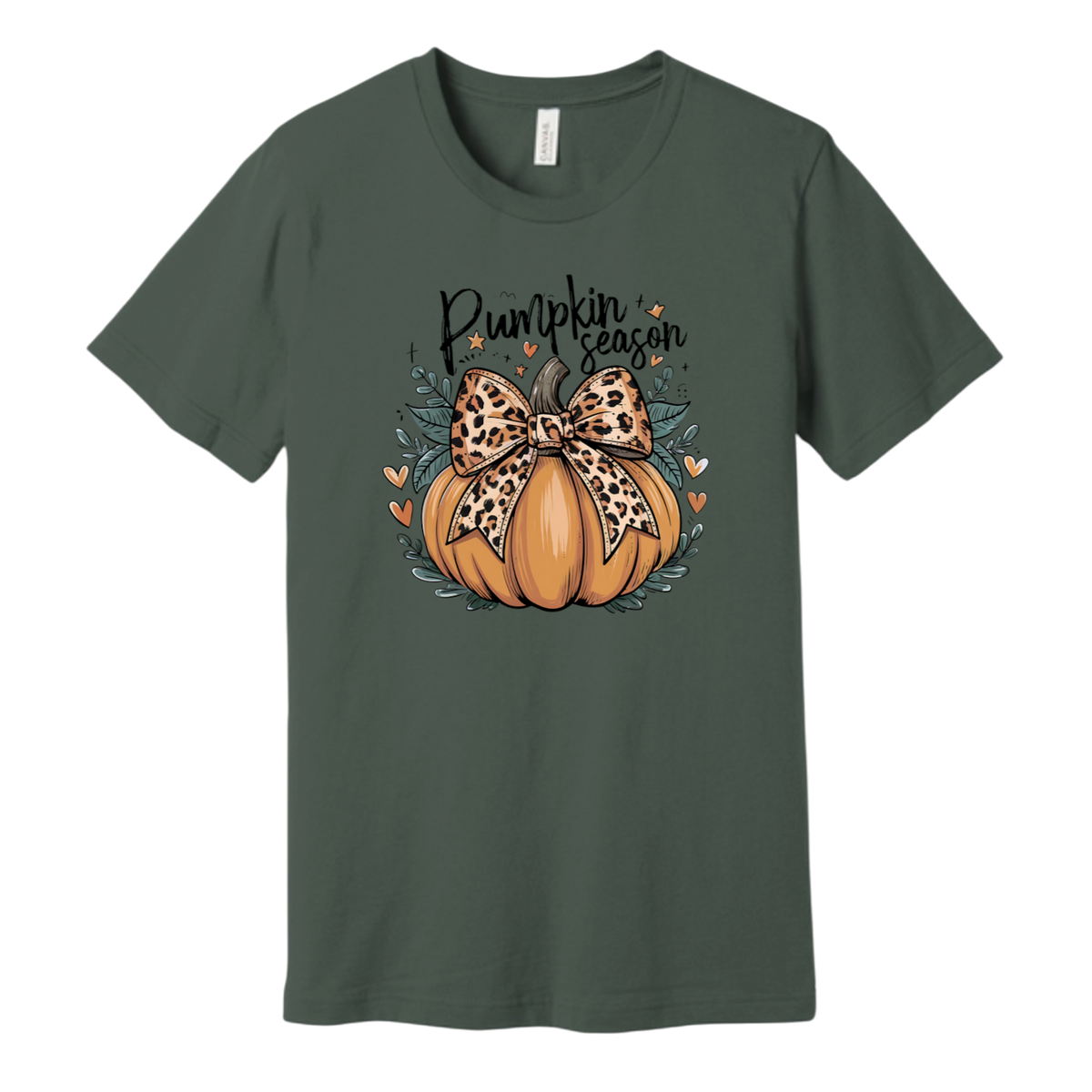 A dark green short-sleeve crewneck t-shirt featuring a 'Pumpkin season' graphic on the chest. The graphic shows an orange pumpkin decorated with a leopard-print bow, surrounded by small orange hearts and leaves.