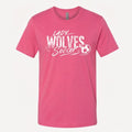 A pink short-sleeve crewneck t-shirt featuring a white distressed graphic on the front that reads 'LADY WOLVES Soccer' alongside a soccer ball illustration, displayed against a light off-white background.